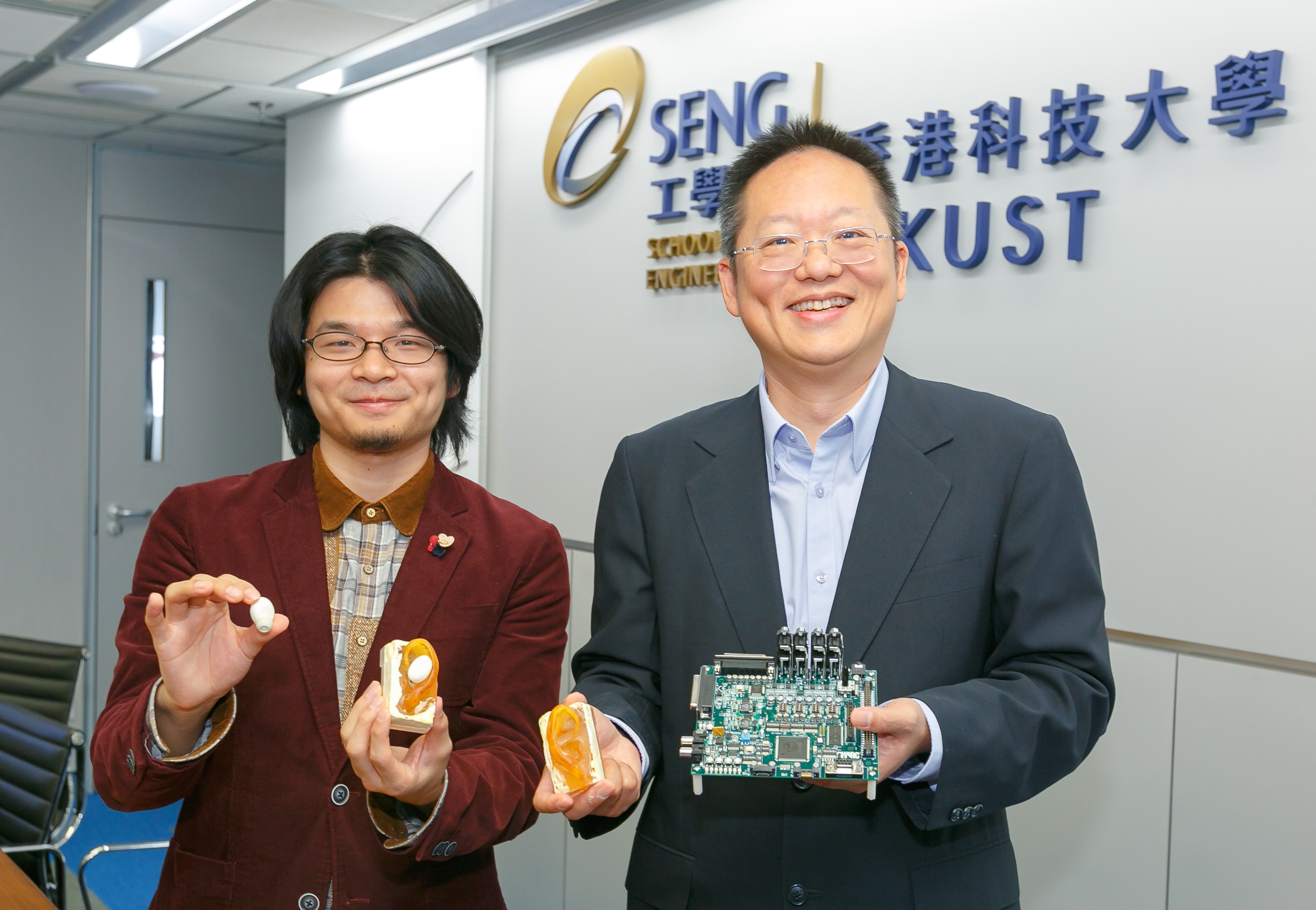 Prof Richard So (right) and Calvin Zhang showcase the research outcome of their audio technology.