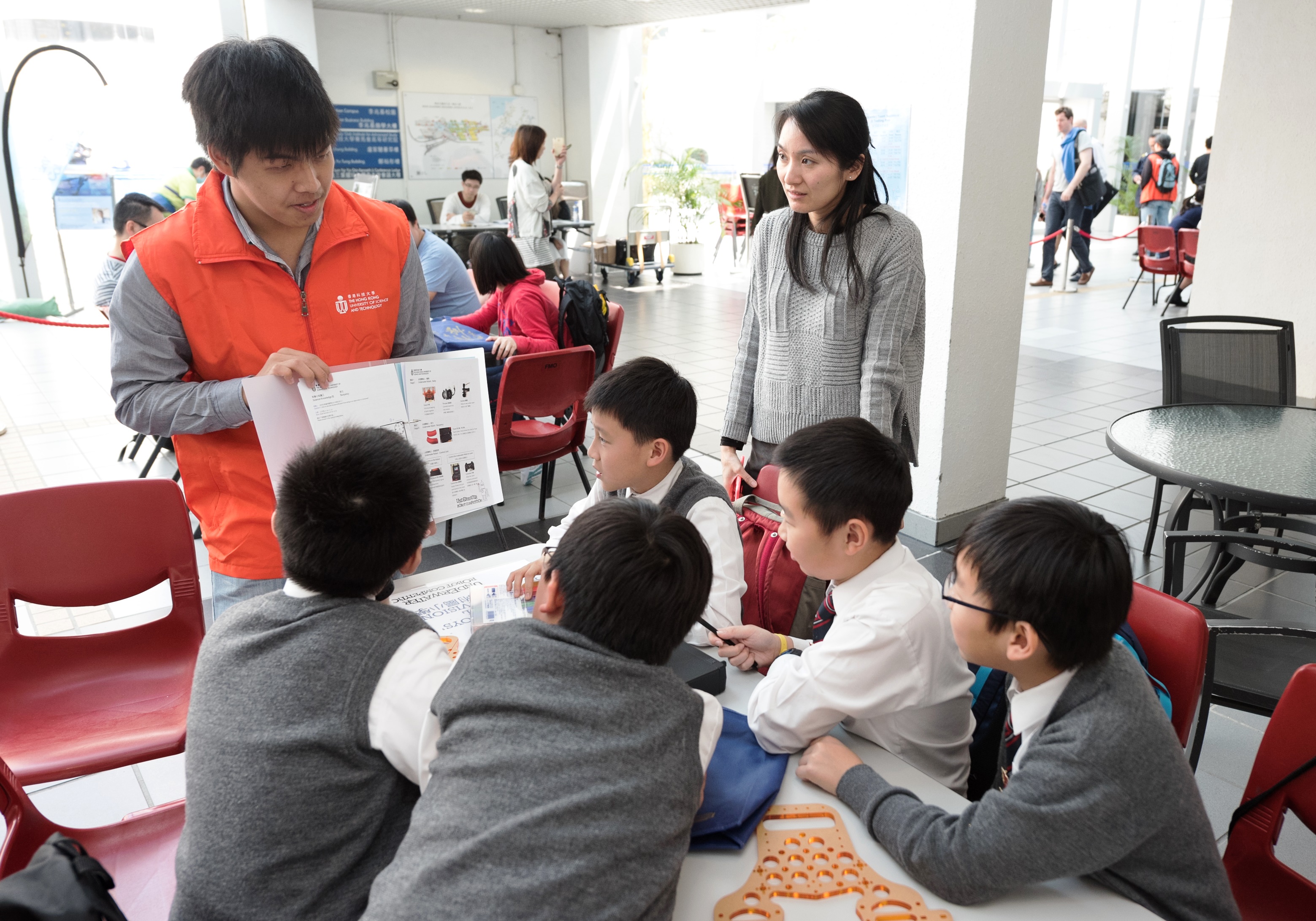  One of the teams is learning science concepts from their mentor.