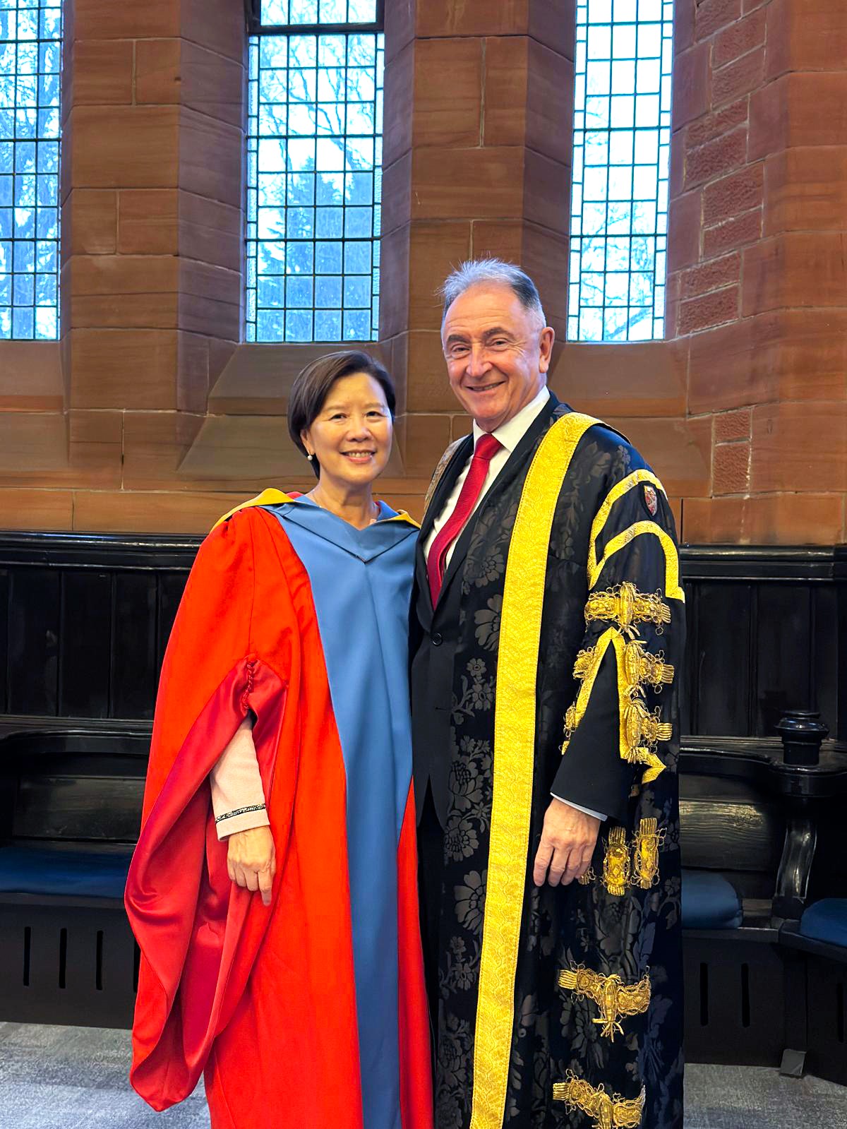 A group photo of Prof. Nancy IP (left) and Sir Jim MCDONALD, Emeritus Principal of the University of Strathclyde (right). 