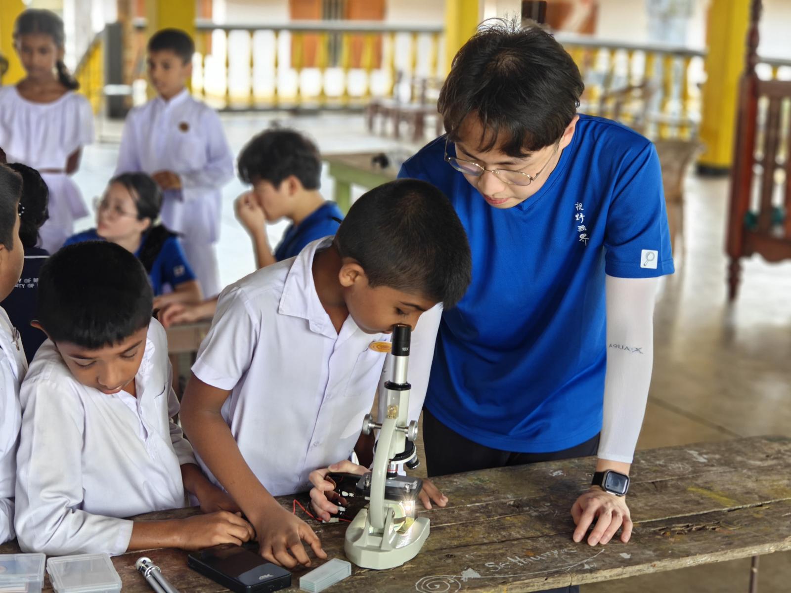 HKUST students conducted experiments with children in Sri Lanka to illustrate the importance of boiling drinking water.