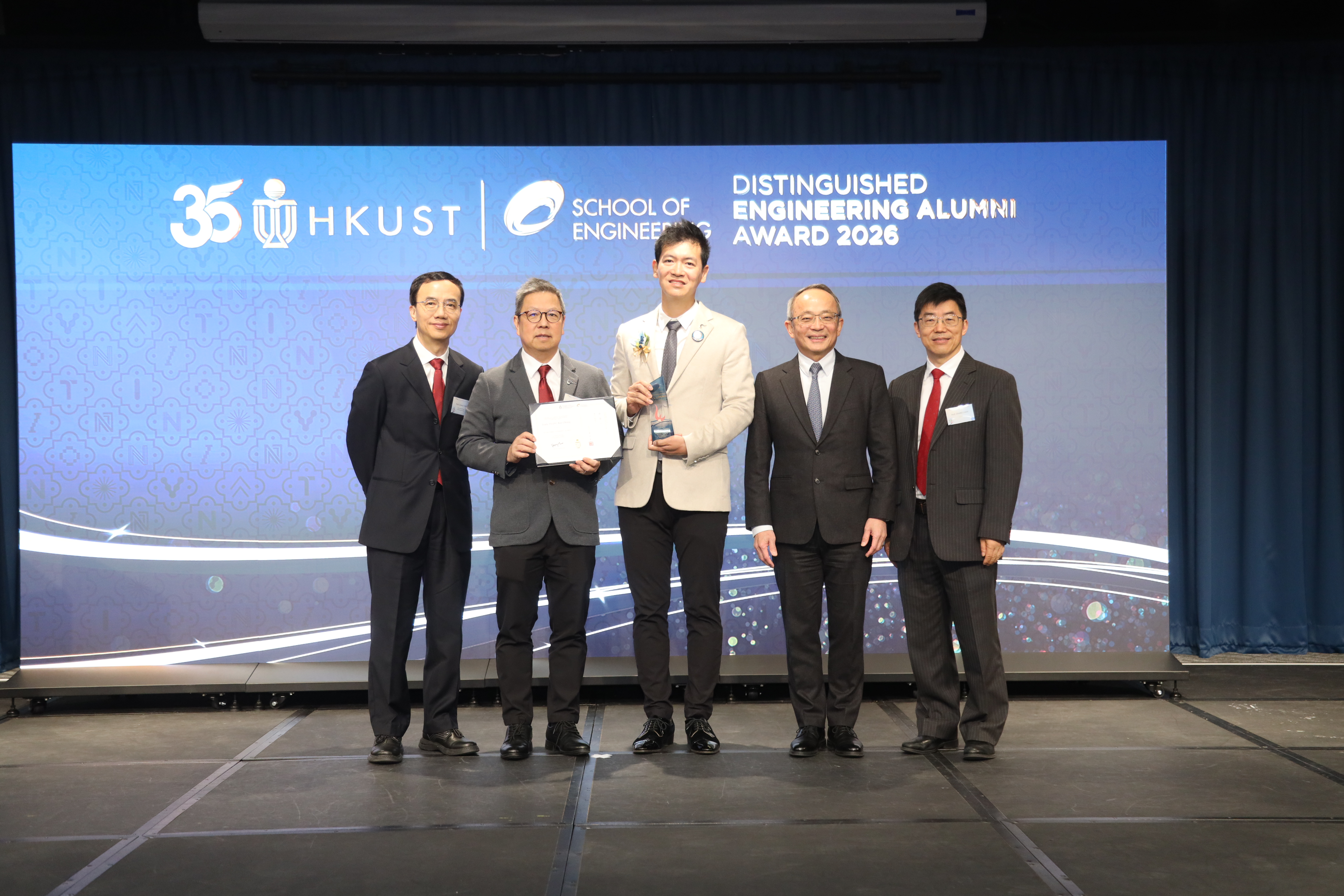 Award recipient Mr. Terry TSANG (center), Prof. Tim CHENG (second right), Vice-President for Research and Development; Prof. Jimmy FUNG (first left), Associate Provost (Teaching & Learning); Prof. Hong K. LO (second left), Dean of Engineering; and Prof. ZHANG Limin (first right), Head and Chair Professor of the Department of Civil and Environmental Engineering.