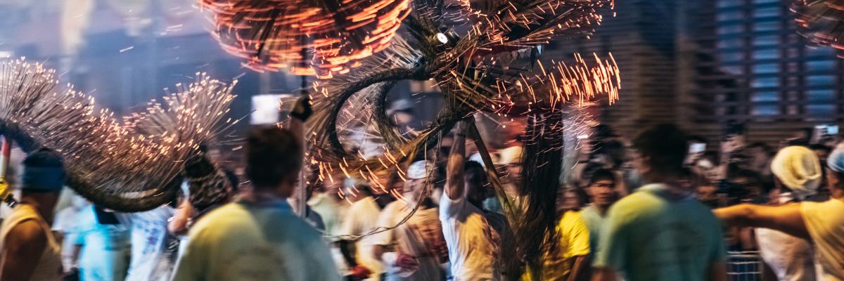Tai Hang Fire Dragon Dance - People performing the dance by holding the body of the dragon, dragon ball and dance through the street